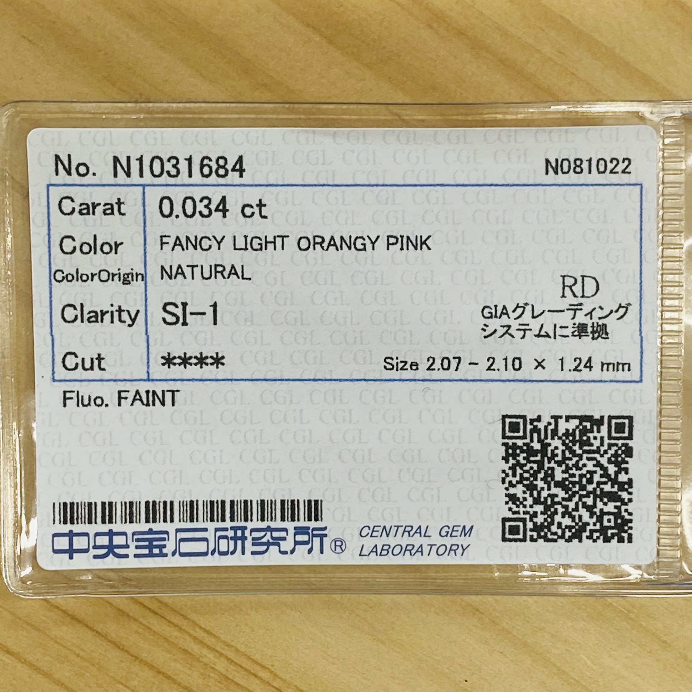 FANCY LIGHT ORANGY PINK 0.034ct RD-